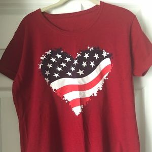 Red tee shirt with flag heart on front. Large